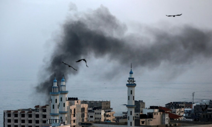 Smoke rises over Gaza City as Israel carries out a second day of air and missile strikes in response to a barrage of rocket fire following its targeted killing of a senior militant commander