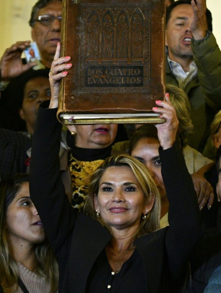Anez brandished a copy of the gospels after being sworn in