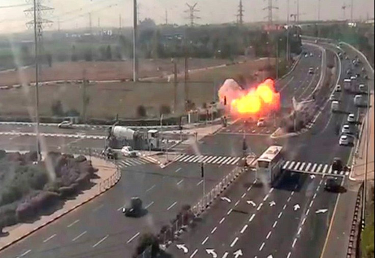 A rocket fired from the Gaza Strip narrowly misses speeding vehicles on a motorway near Israel's Gan Yavne