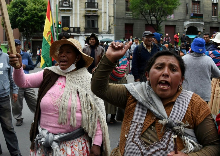 Supporters of Bolivia's ex-president Evo Morales protest in La Paz after he left for exile in Mexico