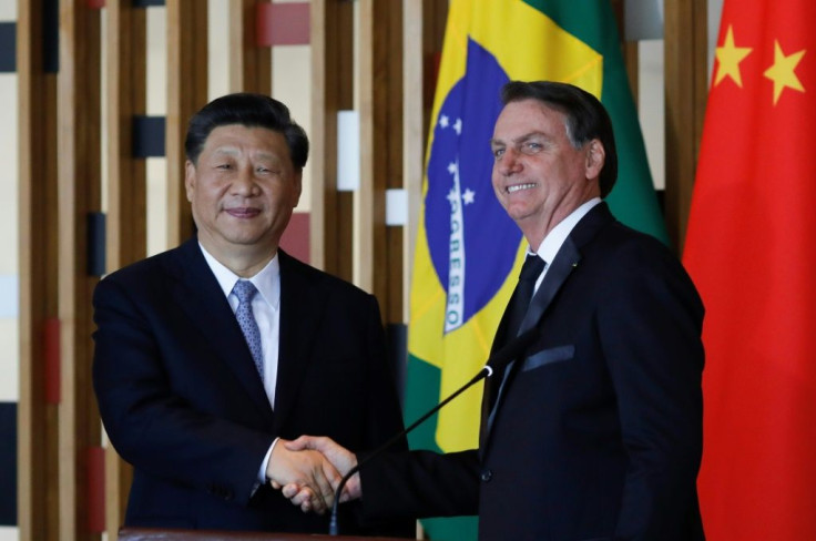 Chinese President Xi Jinping (L) and Brazilian President Jair Bolsonaro after their bilateral meeting in Brasilia on the eve of a BRICS summit