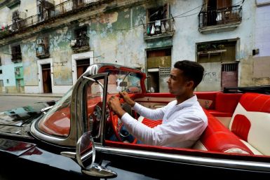 Yosbel Sosa drives tourists around Havana in a 1959 Chevy