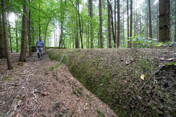 The giant drainage ducts that local historian Dieter Stockmann shows visits are now coated with moss and foilage