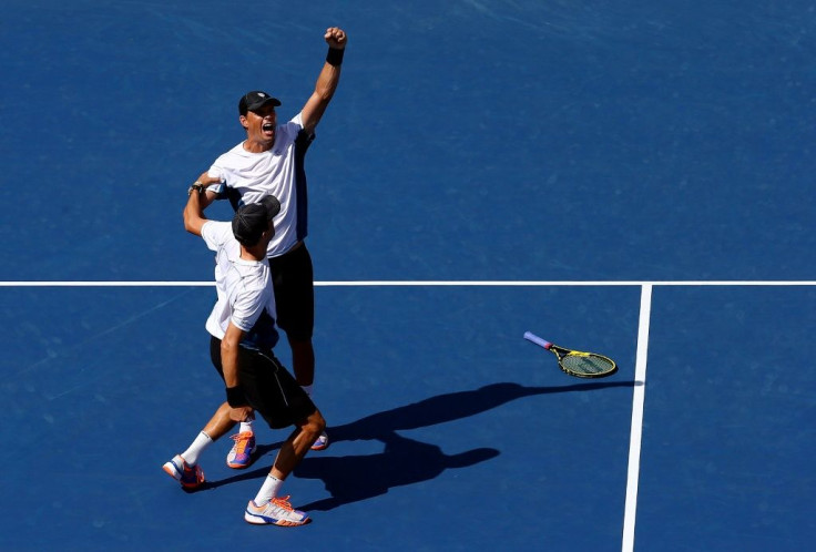 Bob Bryan (top) and Mike Bryan (bottom) celebrate their victory in the men's doubles final at the 2014 US Open