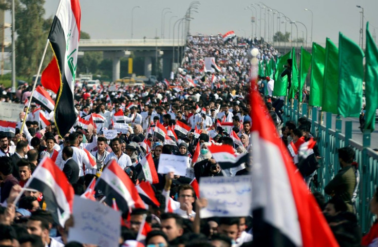 Thousands of Iraqi students swell the protests in the Shiite holy city of Najaf