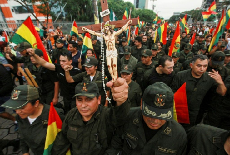 Police joined demonstrators in celebrating Morales's departure