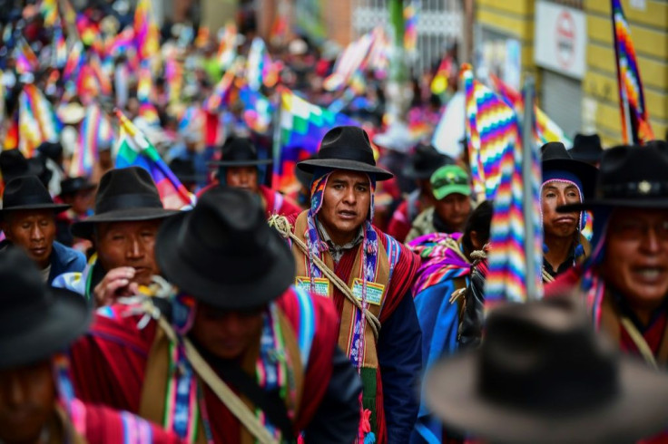 Supporters of Bolivian ex-President Evo Morales, who has accused the new interim leader of orchestrating a "coup," march in La Paz