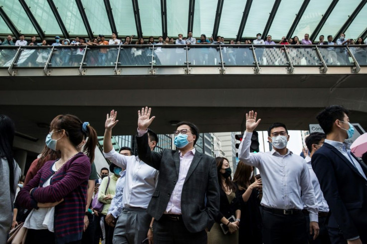 Office workers have taken to Hong Kong's streets this week in support of more hardcore pro-democracy protesters