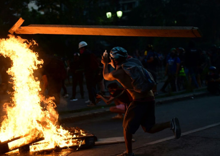 A demonstrator takes part in a protest against the government in Santiago, Chile on November 14, 2019