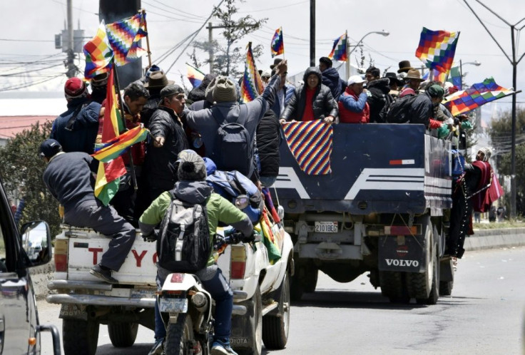 Indigenous supporters of Bolivian ex-president Evo Morales travel from El Alto to La Paz to protest against the interim government on November 15, 2019