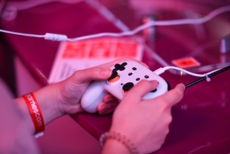 A visitor plays the cloud-based game "Doom" at the Google Stadia booth during Gamescom in Cologne, Germany, on August 21, 2019