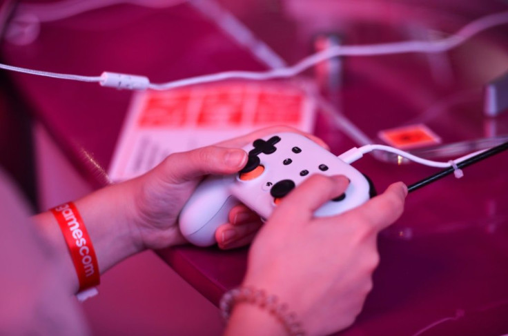 A visitor plays the cloud-based game "Doom" at the Google Stadia booth during Gamescom in Cologne, Germany, on August 21, 2019