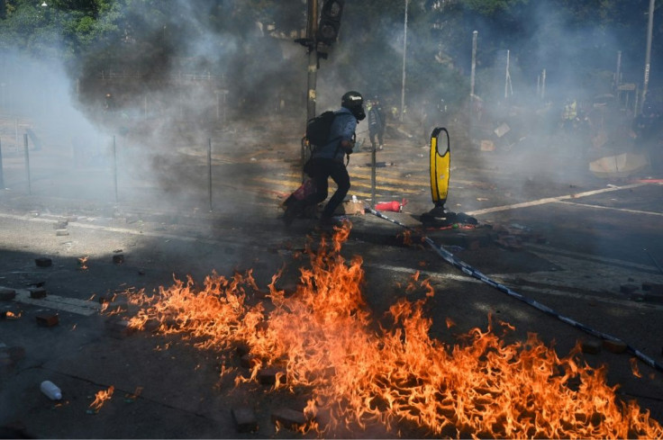 Hardline protesters in Hong Kong threw molotov cocktails shortly before 10.30 am after police fired tear gas