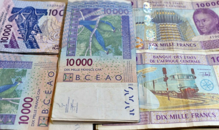 CFA banknotes issued by the Central Bank of West African States -- but the currency's pegging to the euro is controversial and politically sensitive, prompting moves to introduce a new currency, the eco