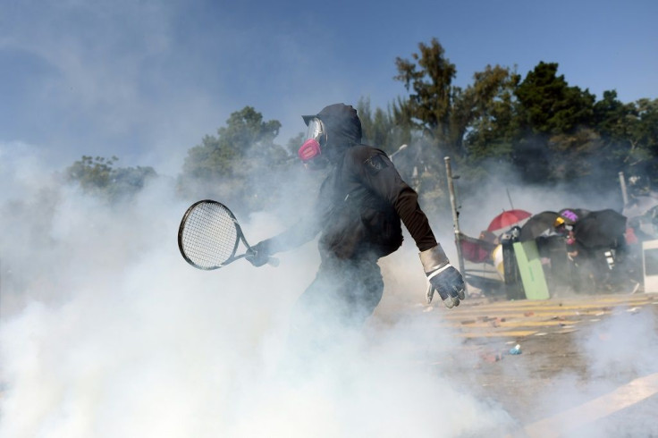 Exchanges of tear gas and petrol bombs broke out as protesters occupying Hong Kong Polytechnic University in Kowloon fight to keeping their stranglehold on a major transport link