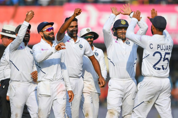 Team culture: India celebrate the dismissal of Bangladesh's Mushfiqur Rahim on their way to a crushing victory in the first Test in Indore
