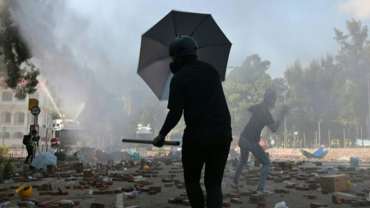 Police deploy water cannon against protesters occupying the campus of the Hong Kong Polytechnic University, now a key battleground as the demonstrators fight to keep a stranglehold on a major tunnel nearby, blocked since TuesdayCOMPLETES 1MC2AF