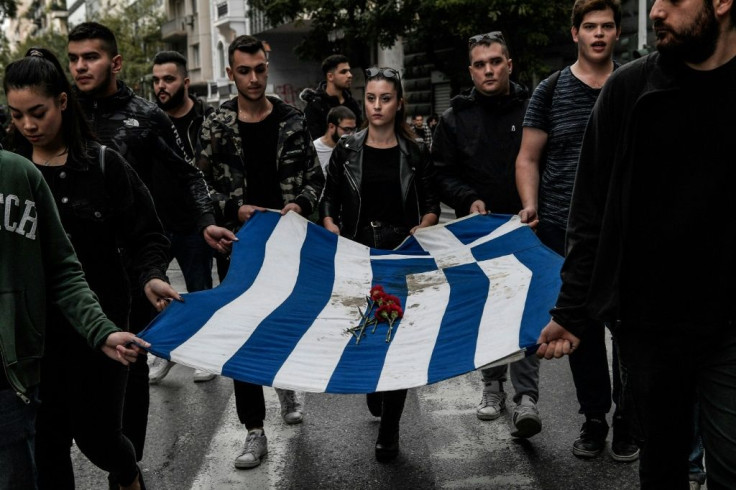 The bloodstained flag that flew over the Polytechnic's iron gate is traditionally carried at the head of the demonstration in the capital