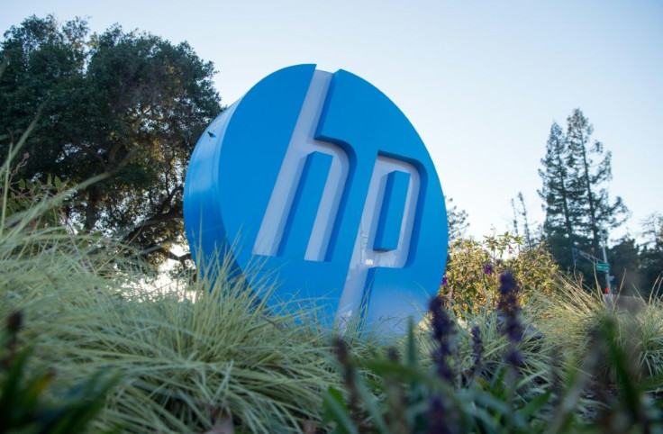(FILES) In this file photo taken on November 4, 2016 the HP logo is seen on a sign at Hewlett Packard's headquarters in Palo Alto, California; HP has not ruled out a merger with Xerox