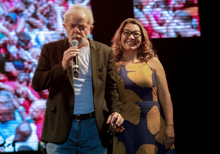 Picture released by Folha de Pernambuco showing Brazilian former President Luiz Inacio Lula da Silva speaks next to his his girlfriend Rosangela da Silva during the 'Free Lula' music Festival in Recife, Pernambuco state, Brazil, on November 17, 2019.