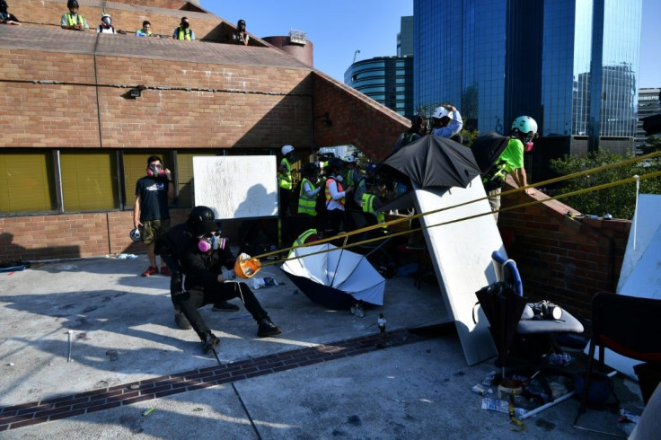 Protesters used a catapult to fire bricks at police from inside the Hong Kong Polytechnic University