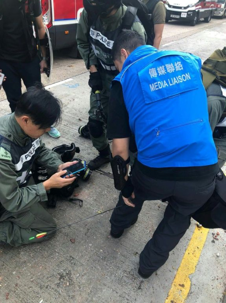 A police officer was shot in the leg by an arrow in Hong Kong