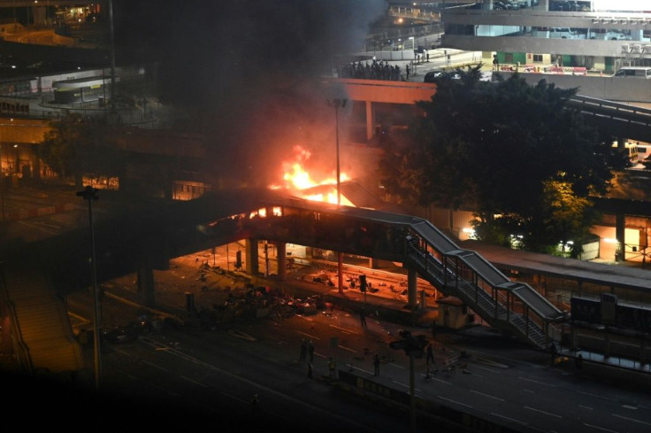Police tried to retake a footbridge over a tunnel in Hong KongÂ but were met by a barrage of petrol bombs that caused a huge fire