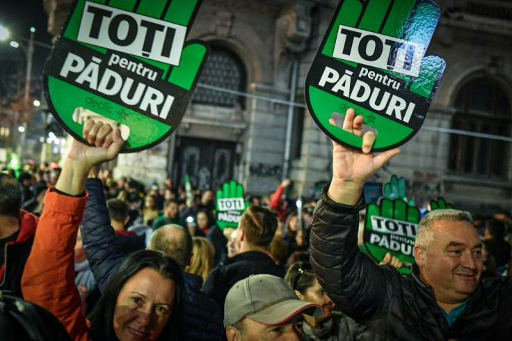 Romanians held placards reading "All for the forests" during a protest on November 3 against illegal logging