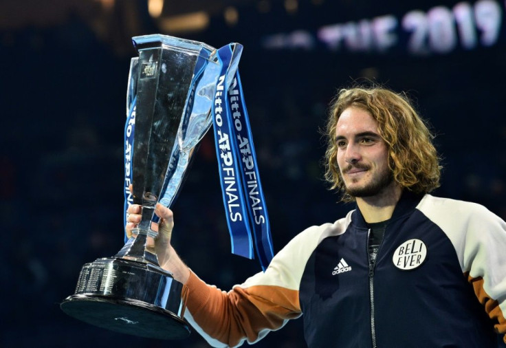 Stefanos Tsitsipas poses with the ATP Finals trophy