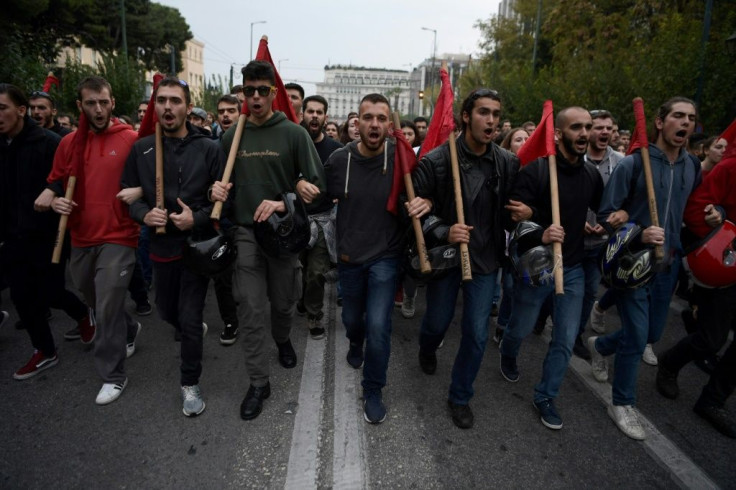 Over 30,000 Greeks demonstrated in Athens and other major cities under a heavy police presence Sunday to mark the anniversary of a 1973 anti-junta uprising