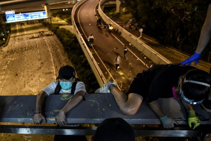 Protesters escaped by shimmying down a rope