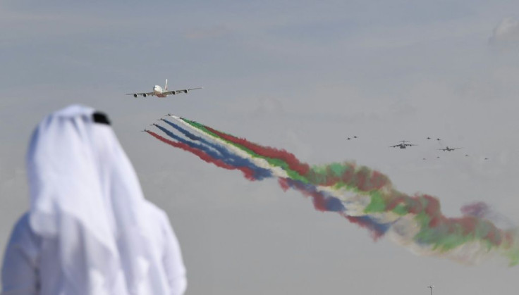 The UAE air force aerobatic team performs at the Dubai Airshow with an Airbus A380 superjumbo, which airlines have struggled to fill to capacity