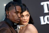 Kylie Jenner, shown with rapper Travis Scott, reached a deal to sell a majority stake in her cosmetics business to Coty for $600 million