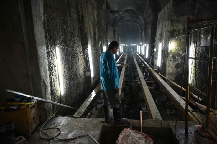 A worker stands near the entrance of El Deposito, a Spanish-era reservoir being redeveloped for tourism in suburban Manila