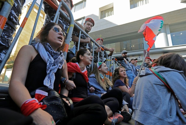 From early morning, hundreds of noisy protesters and riot police had faced off and briefly scuffled outside the assembly in Beirut, with activists also trying to stop MPs' cars from entering and police firing warning shots