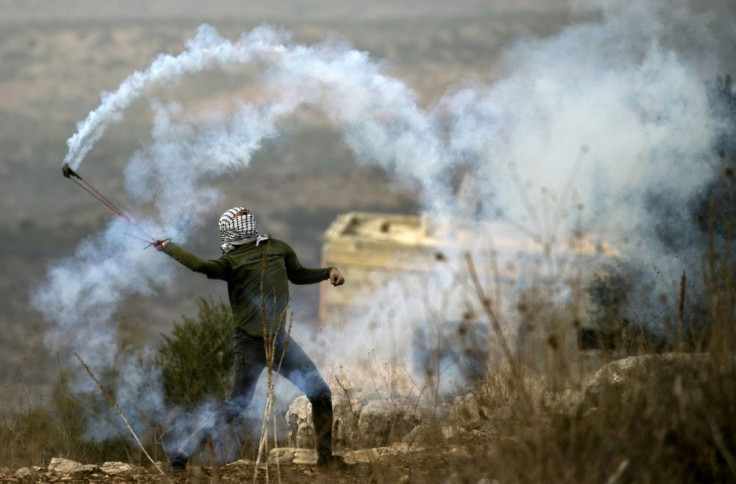 Palestinian protesters hold weekly demonstrations in the West Bank village of Kfar Qaddum against Israeli expropriation of their land to make way for homes for settlers