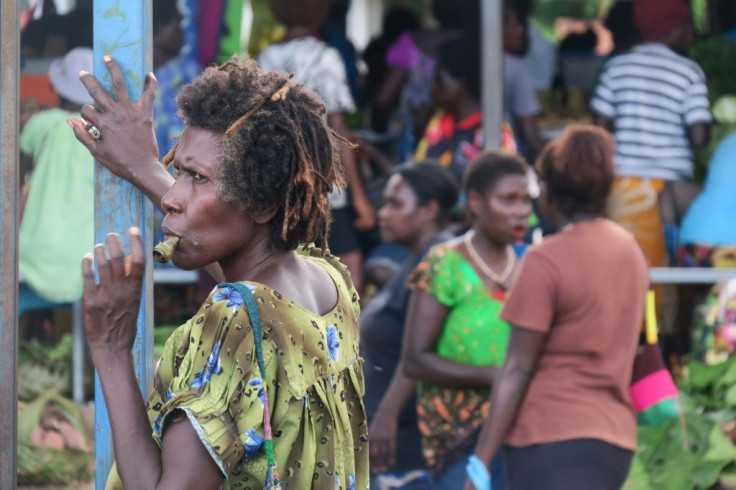 In this picture taken on January 11, 2019, a woman chews betal nut at a market in Arawa, which was the capital and largest town in the autonomous region of Bougainville.