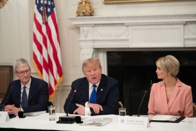 Apple CEO Tim Cook, seen here at a meeting of the American Workforce Policy Advisory Board at the White House, has reportedly worked with the president's daughter Ivanka (R) and her husband Jared Kushner to keep communication channels open