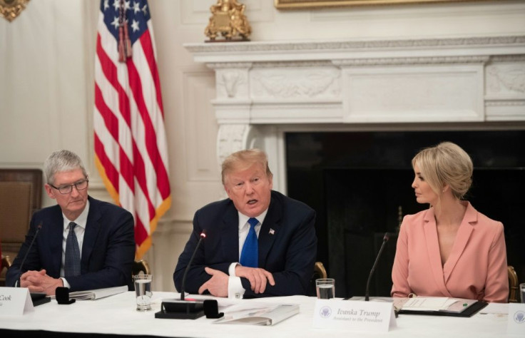 Apple CEO Tim Cook, seen here at a meeting of the American Workforce Policy Advisory Board at the White House, has reportedly worked with the president's daughter Ivanka (R) and her husband Jared Kushner to keep communication channels open