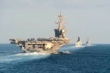 The US aircraft carrier strike group Abraham Lincoln sailed on Tuesday through the Strait of Hormuz, a chokepoint for a third of the world's seaborne oil