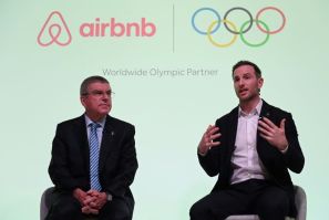 IOC President Thomas Bach, left, announced the deal at a London press conference with Airbnb co-founder Joe Gebbia on Tuesday