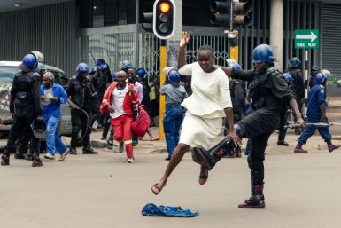 Zimbabwe anti-riot police fired tear gas and beat protesters in an opposition rally, AFP reporters said