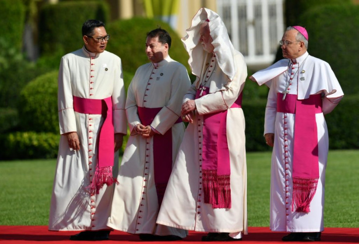 Cardinals await the Pope's arrival at Government House in Bangkok