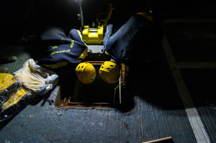 Fire service personnel have searched the drains for people who may have tried to escape the university through the sewers