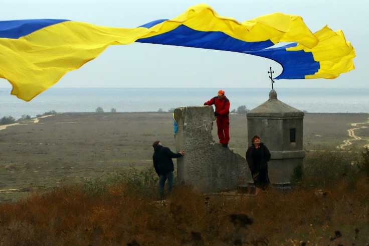 The vessels were greeted from the shore by Ukrainians holding national flags
