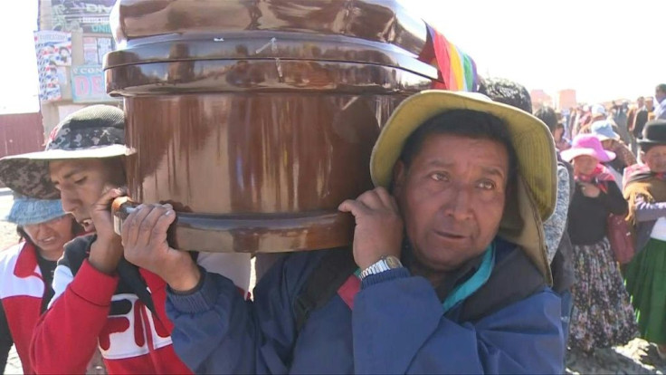 Thousands of people who accompanied the funeral procession of killed Bolivian protesters from El Alto arrive in nearby La Paz