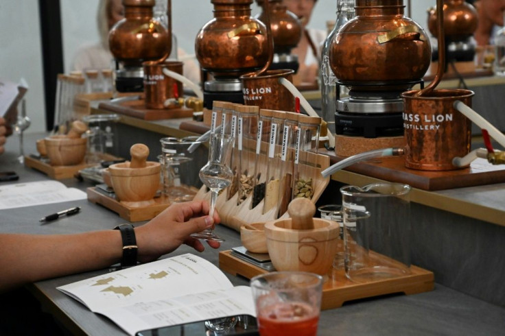 In a Singapore distillery, the smell of pine, citrus and flowers fills the air as students crush juniper berries, blending them with their own choice of ingredients to make custom gin with an Asian twist