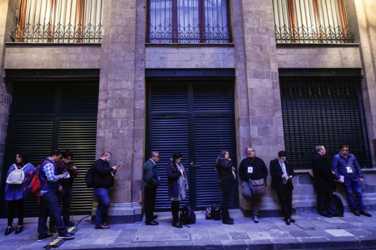 Journalists line up from 5:30 am outside the National Palace, on Mexico City's central square, to attend the president's daily press conference