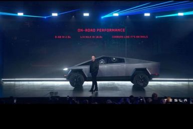 Tesla Chief Executive Elon Musk stands in front of the company's first electric pickup truck, the Cybertruck, after it was unveiled in Los Angeles