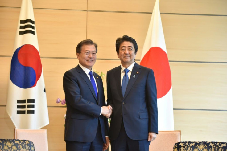 South Korea's President Moon Jae-in in happier times with Japan's Prime Minister Shinzo Abe